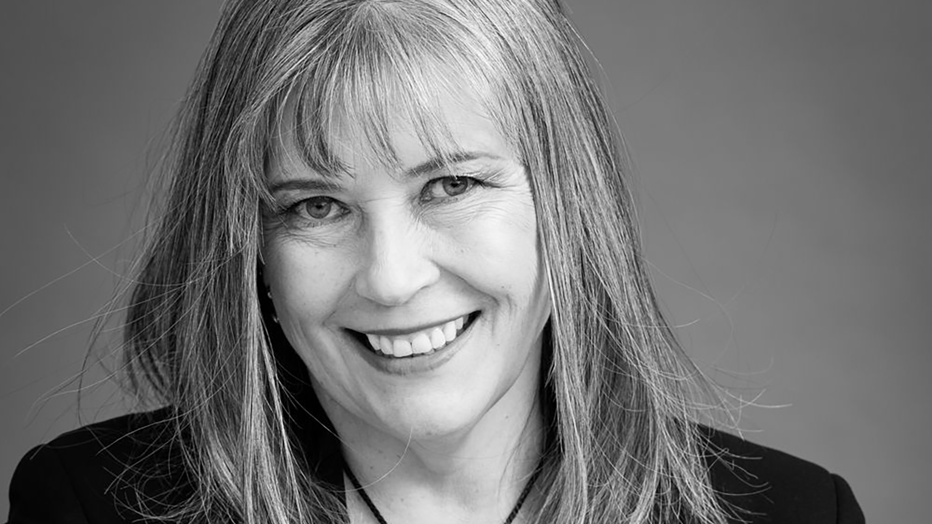 Black and white picture of a woman smiling