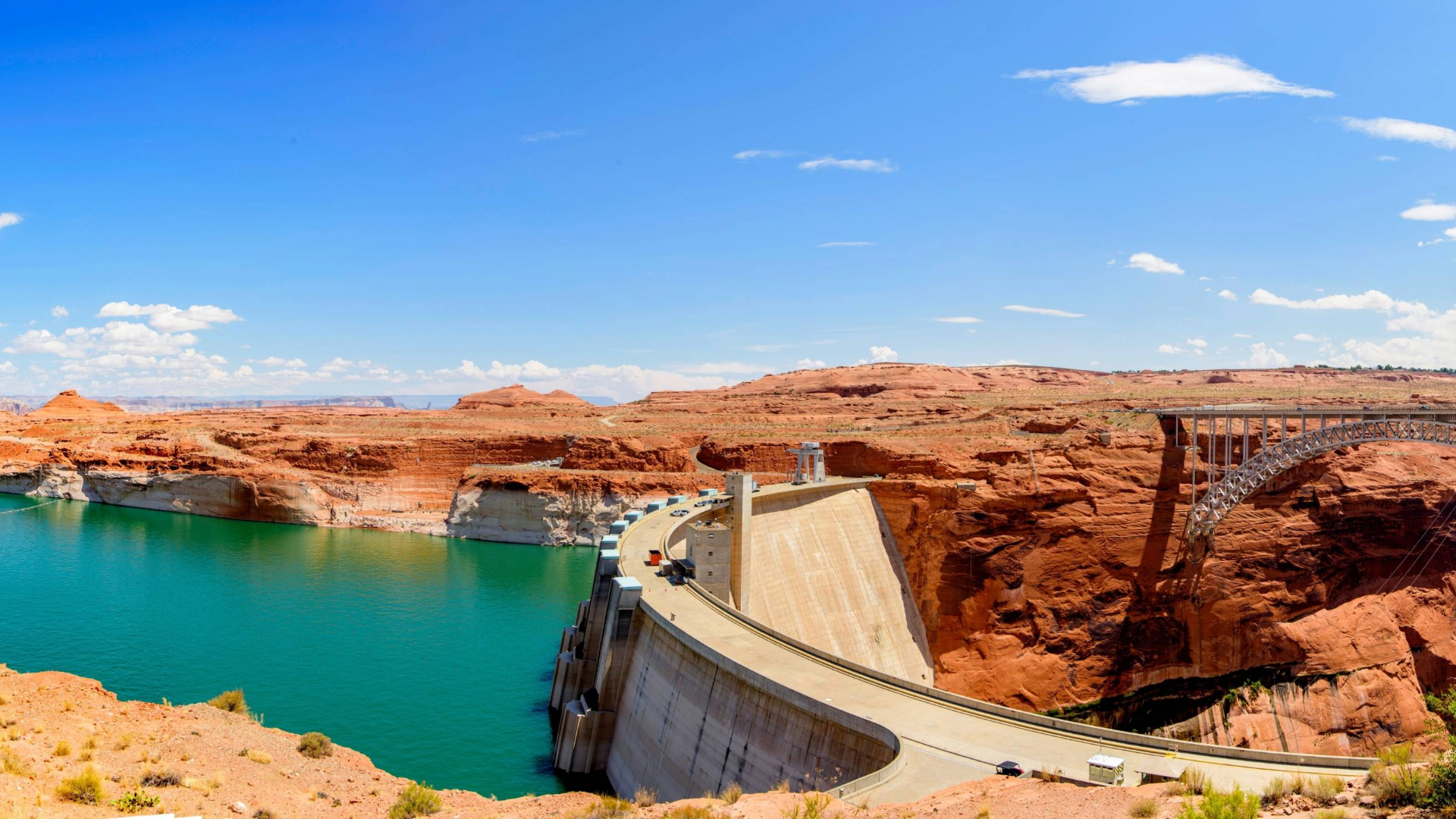 Glen Canyon Dam with Lake Powell and surrounding red rock canyon landscape