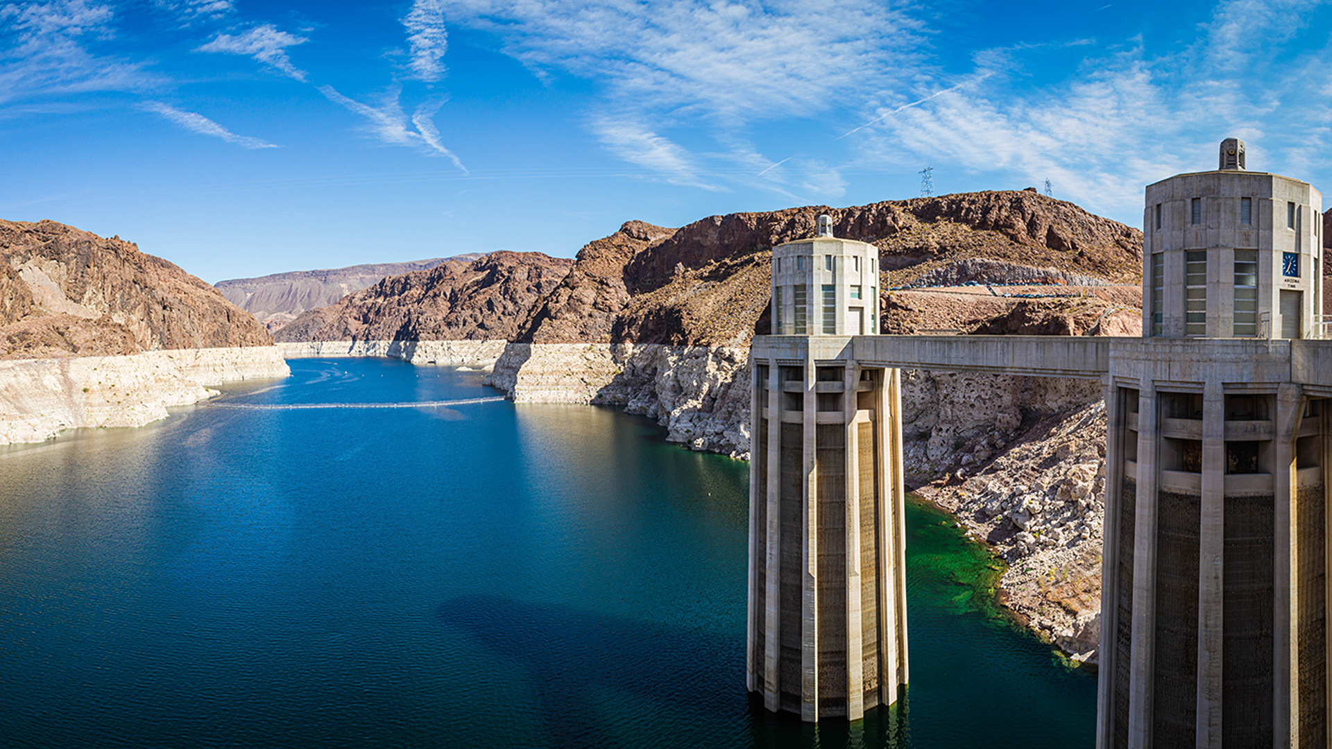 Panorama image looking into Lake Mead from the Hoover dam with the bleached high waterline of the dam.