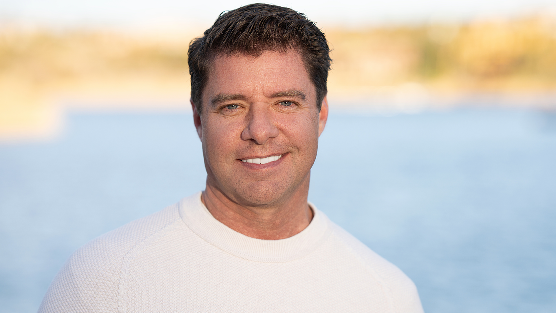 Man with brown hair smiling